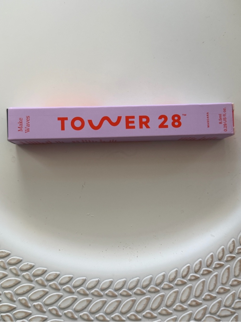 Tower 28 Mascara Tube in Pastel Pink with Bright Orange Logo